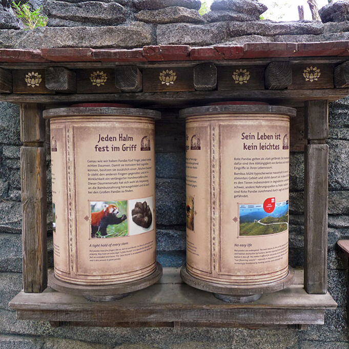 two scenographic Tibetan prayer wheels as part of the final exhibition design