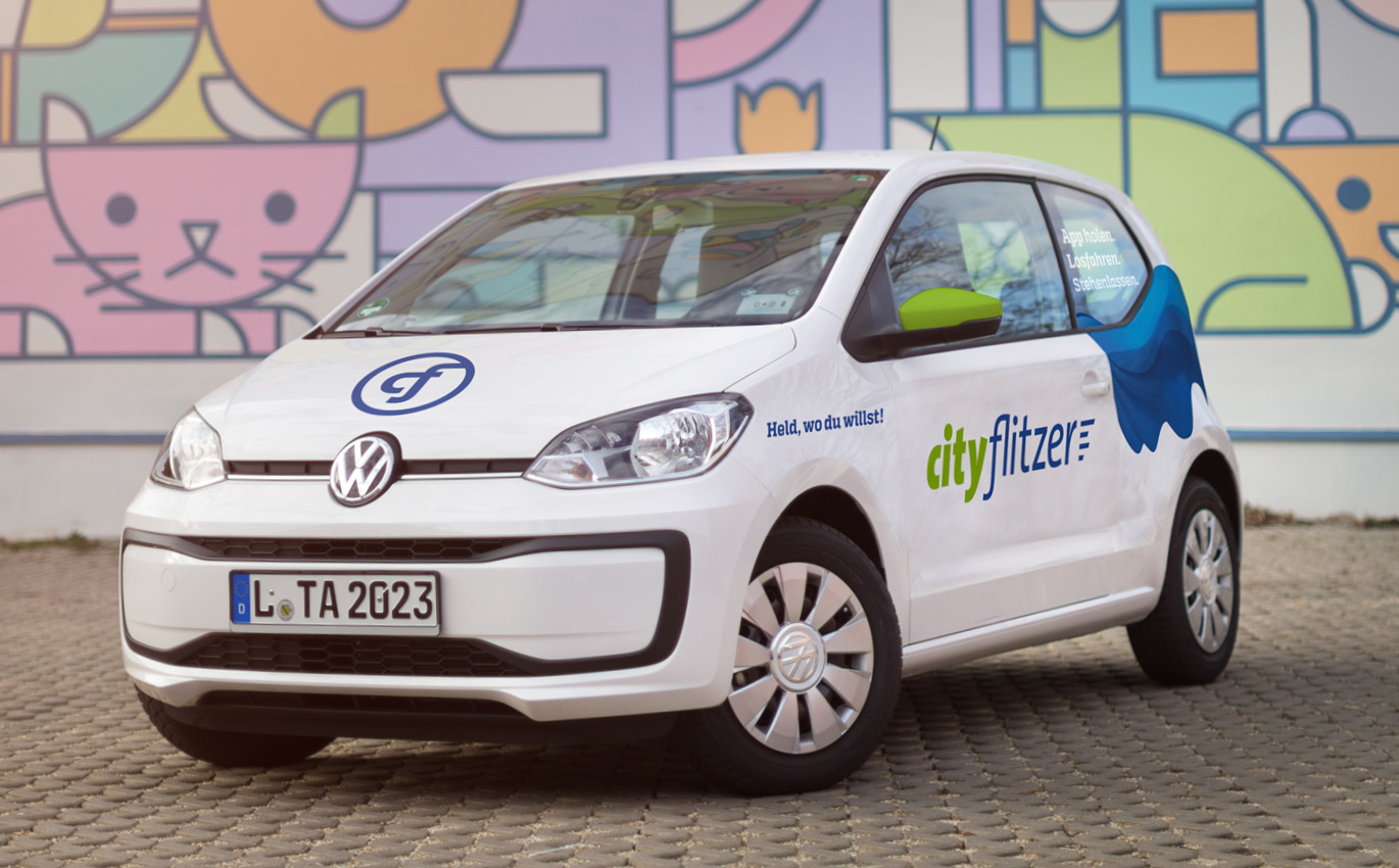Car with sticker of the corporate design branding of cityflitzer
