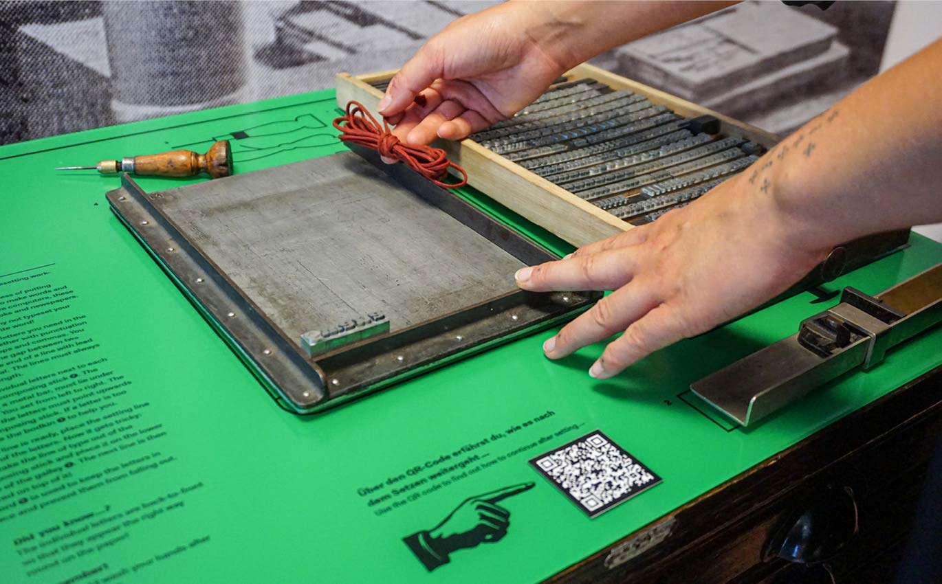 Hand typesetting with lead letters and the necessary tools 