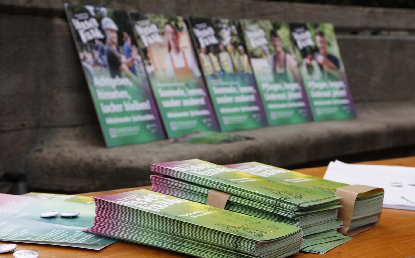 Print products from the campaign are displayed on a table